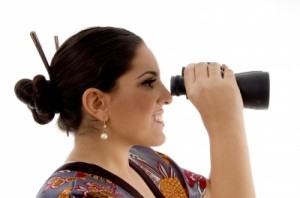 woman looking in binoculars