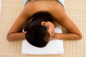 Woman lying on stomach relaxing